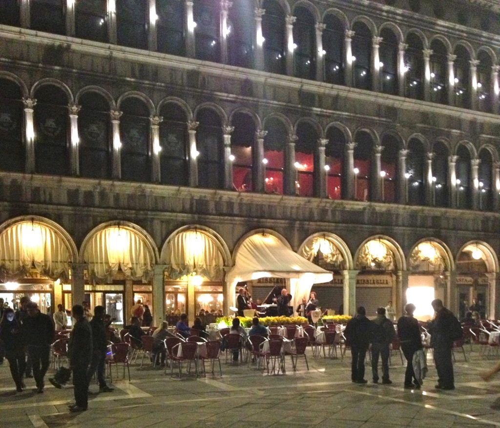 Venice with teens: Band playing at night outside cafe in St Marks square. Copyright©2015 reserved to photographer. Contact mapandfamily.com