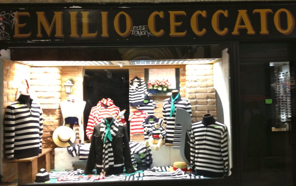 Venice with kids: striped gondoliers' shirts in shop. Copyright©2015 reserved to photographer. Contact mapandfamily.com
