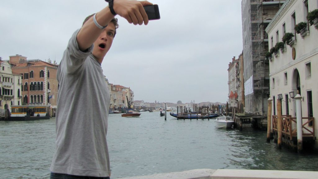 Venice with teens: Taking selfie outside Guggenheim. Copyright©2015 reserved to photographer. Contact mapandfamily.com