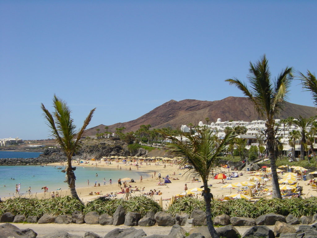 Family holidays in April with teens, view of Playa Blanca, Lanzarote. Photo copyright © cachet travel.