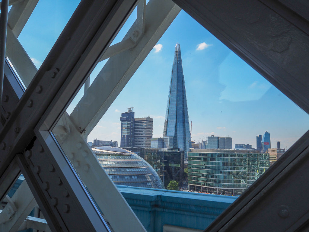 View of The Shard framed by ironwork on Tower Bridge. Copyright ©2018 mapandfamily.com 