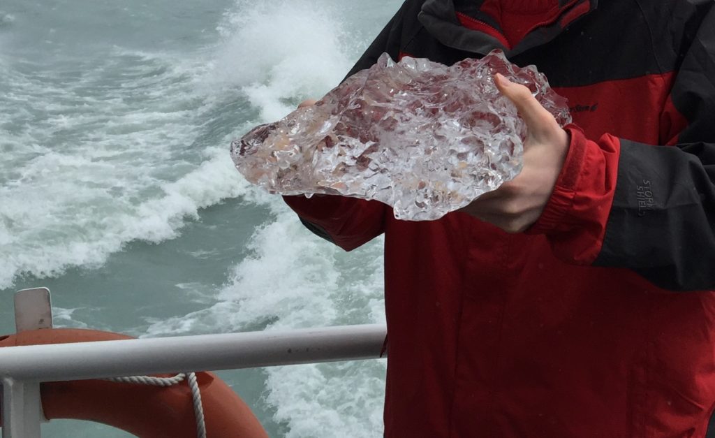 Boy holding glacier ice. Copyright©2015 reserved to photographer. Contact mapandfamily.com