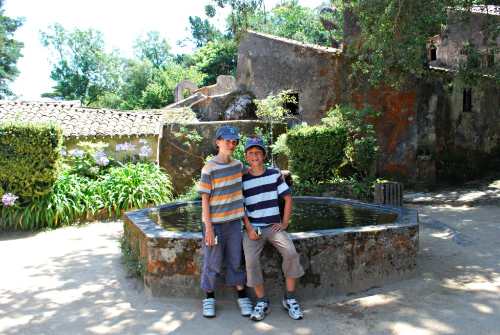 Lisbon for kids. Two boys in courtyard of Capuchos convent, Sintra. Copyright©2015 reserved to photographer. Contact mapandfamily.com