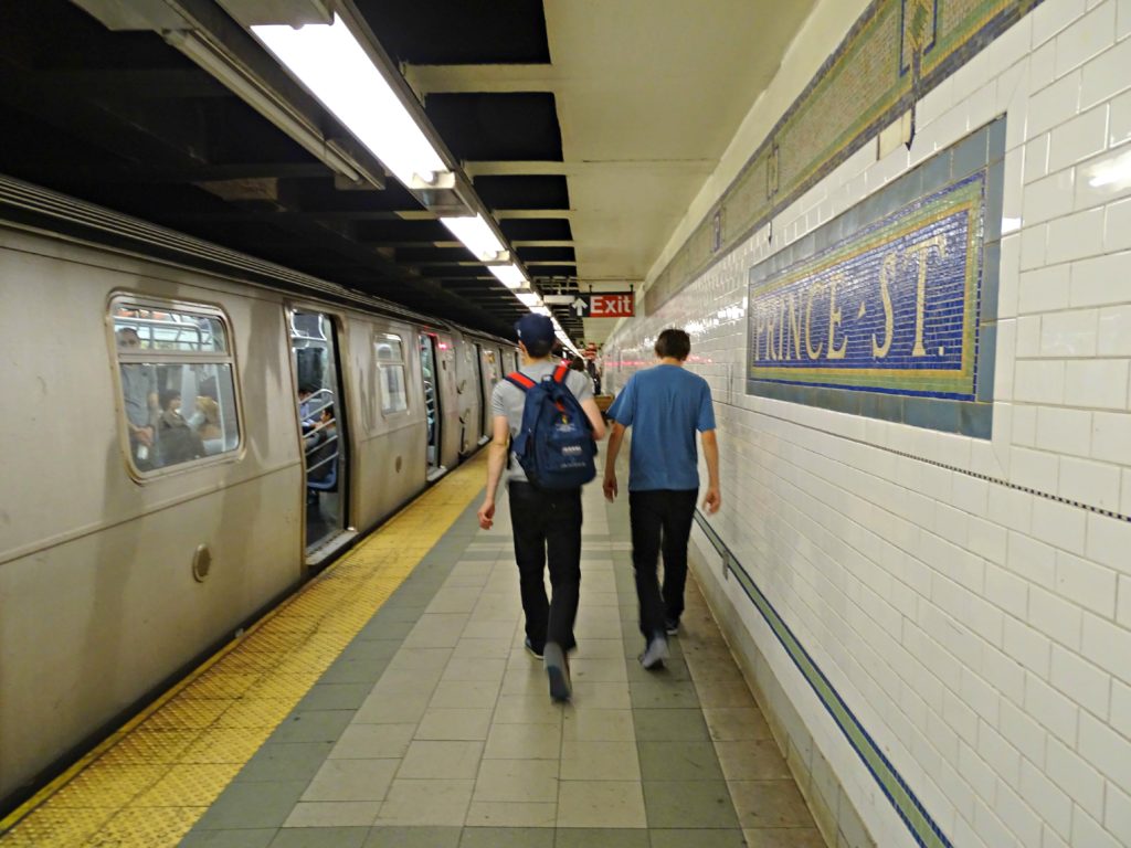 New York with teens: walking along a subway platform. Copyright©2015 reserved Nancy Roberts. Contact mapandfamily.com