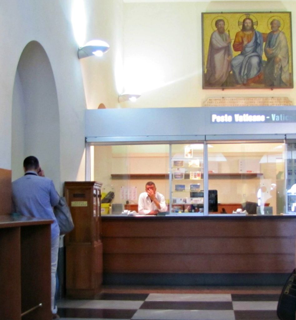 What to do in Rome: post a card at the Vatican Rome with teens: visiting the Vatican post office counter. Copyright©2016 reserved to photographer via mapandfamily.com