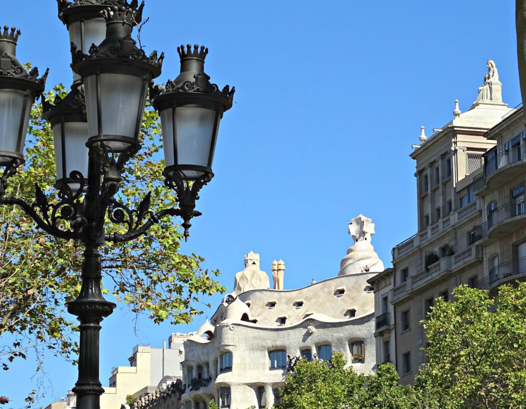 Where to stay in barcelona first time. Ornate black street lamps and the rooftops of La Pedrera. Copyright©2016 reserved to photographer via mapandfamily.com
