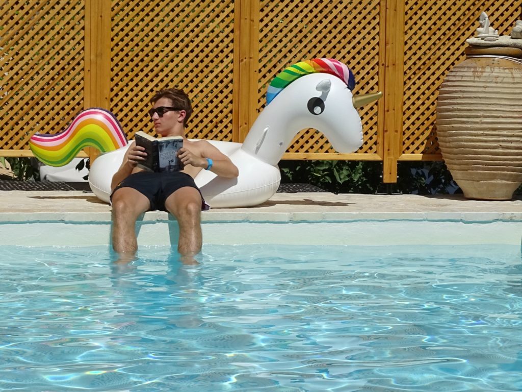 Paxos holidays, reading by pool at Villa Avra Copyright©2017 mapandfamily.com 