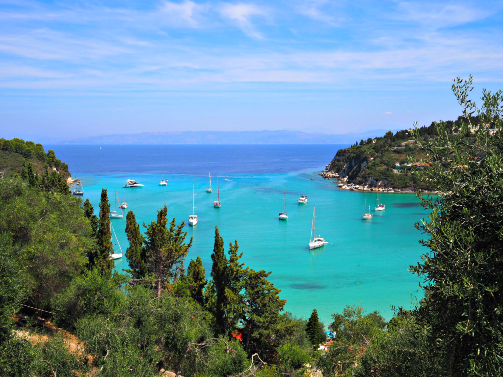 Lakka Paxos, view of the bay with turquoise water and small white boats. Copyright © 2017 reserved to photographer via mapandfamily.com 