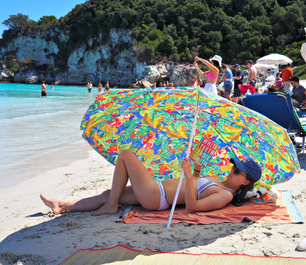 Voutoumi beach Antipaxos: reading in the shade