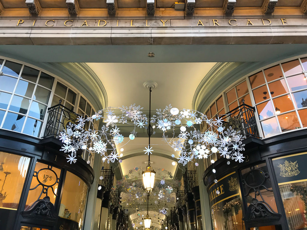 Entrance to Piccadilly arcade with Christmas decorations. Copyright ©2018 mapandfamily.com 