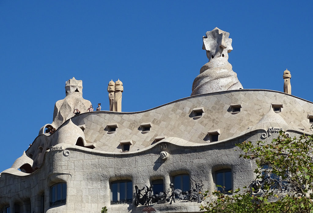 Rooftop of Casa Mila in Barcelona showing the sentinel-like chimneys. Copyright© 2019 mapandfamily.com 