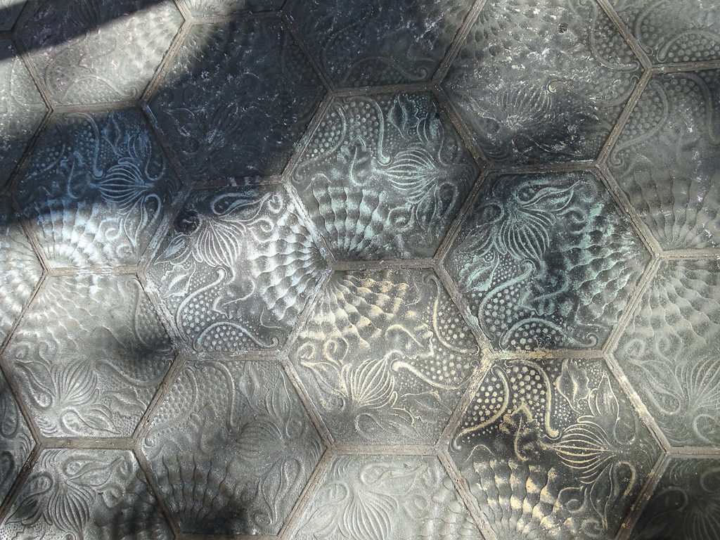 Gaudi designs on pavement in Barcelona. Copyright© 2019 mapandfamily.com 
