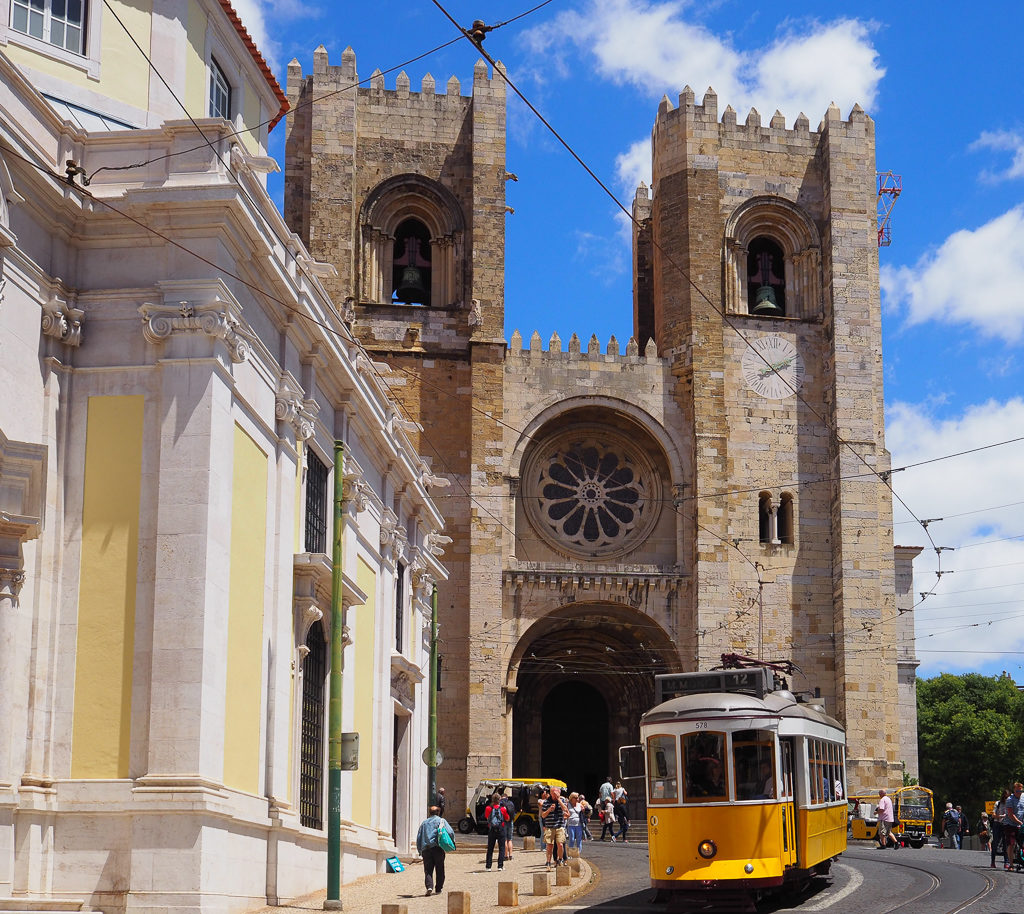 Cathedral and yellow tram in Lisbon. Copyright ©2019 mapandfamily.com 