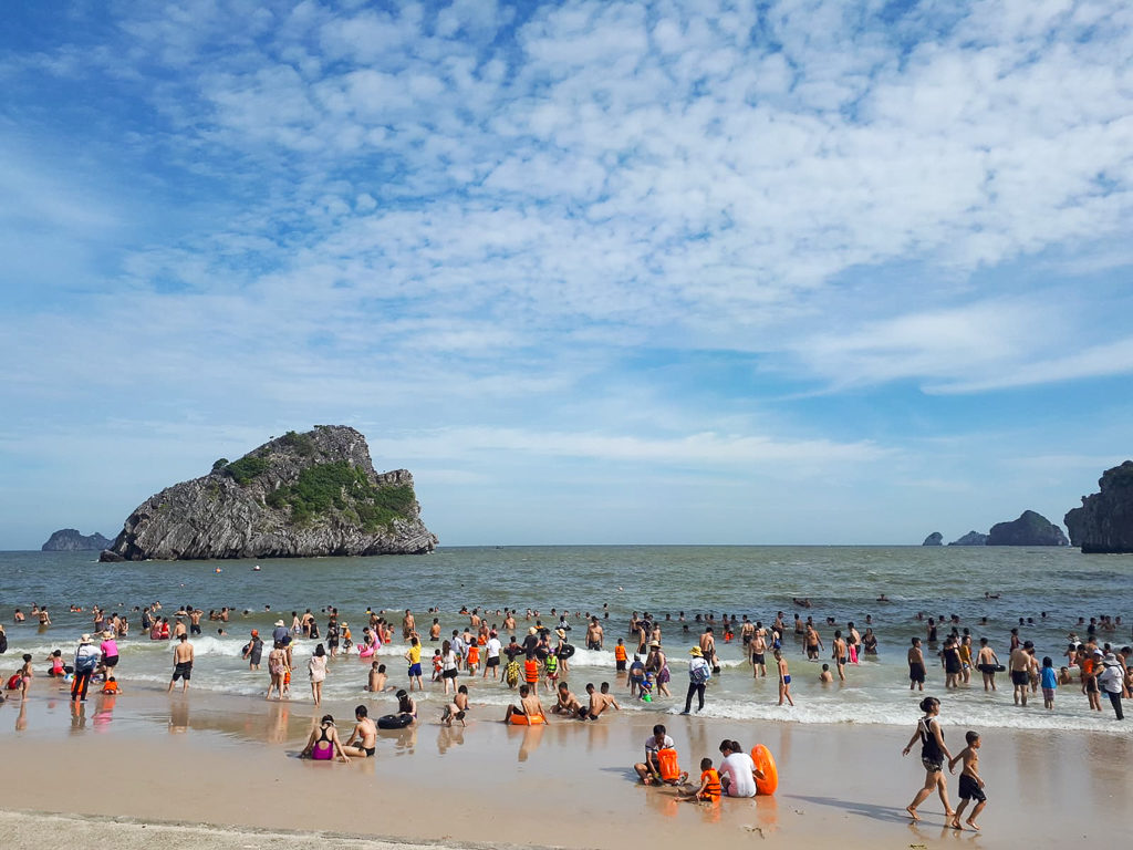 Vietnam itinerary. A busy beach on Cat Ba island. Copyright ©2019 mapandfamily.com