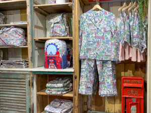 Backpacks and pyjamas in a London scene print, in interior of Cath Kidston store. Copyright ©2019 mapandfamily.com