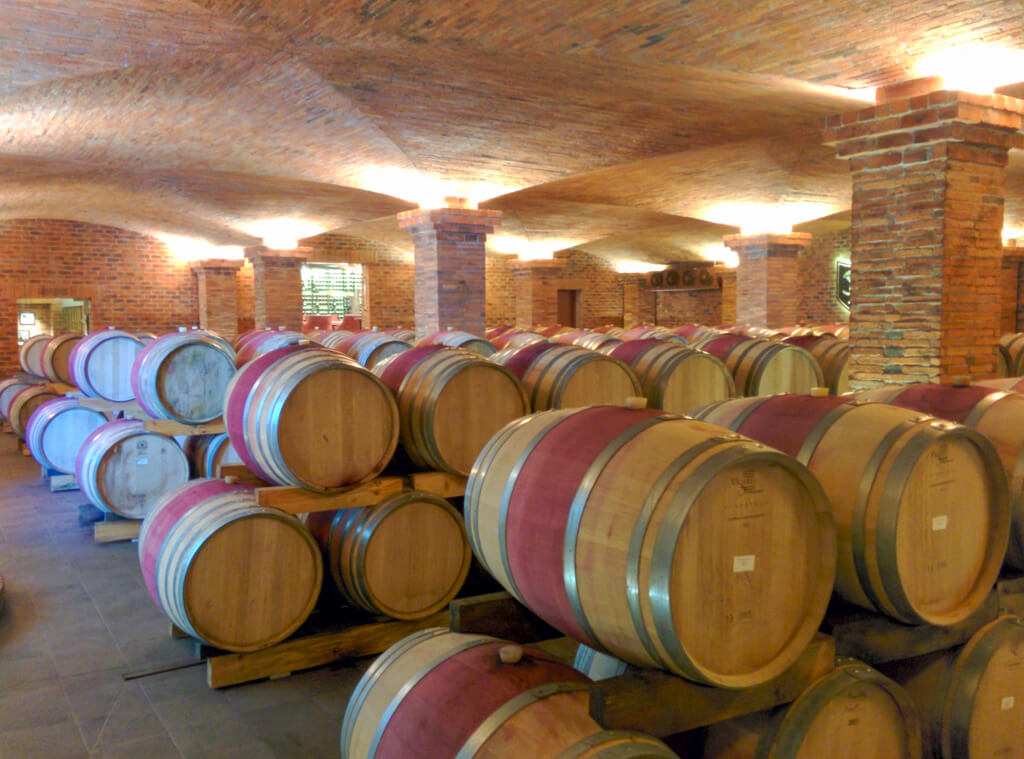 A cellar full of barrels at La Motte winery. Copyright@2023 reserved to photographer via mapandfamily.com