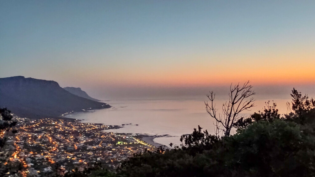 View of Cape Town beaches at sunset from Lion's Head. Copyright@2023 reserved to photographer via mapandfamily.com