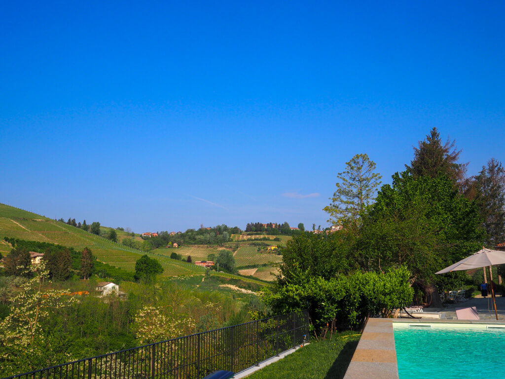 The view of hillside and valley from the outdoor pool at Villa Giara.Copyright@2023mapandfamily.com