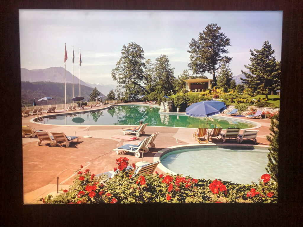 A colourful image of a photo of a swimming pool from mid 20th century. Copyright@2023 reserved to photographer via mapandfamily.com 