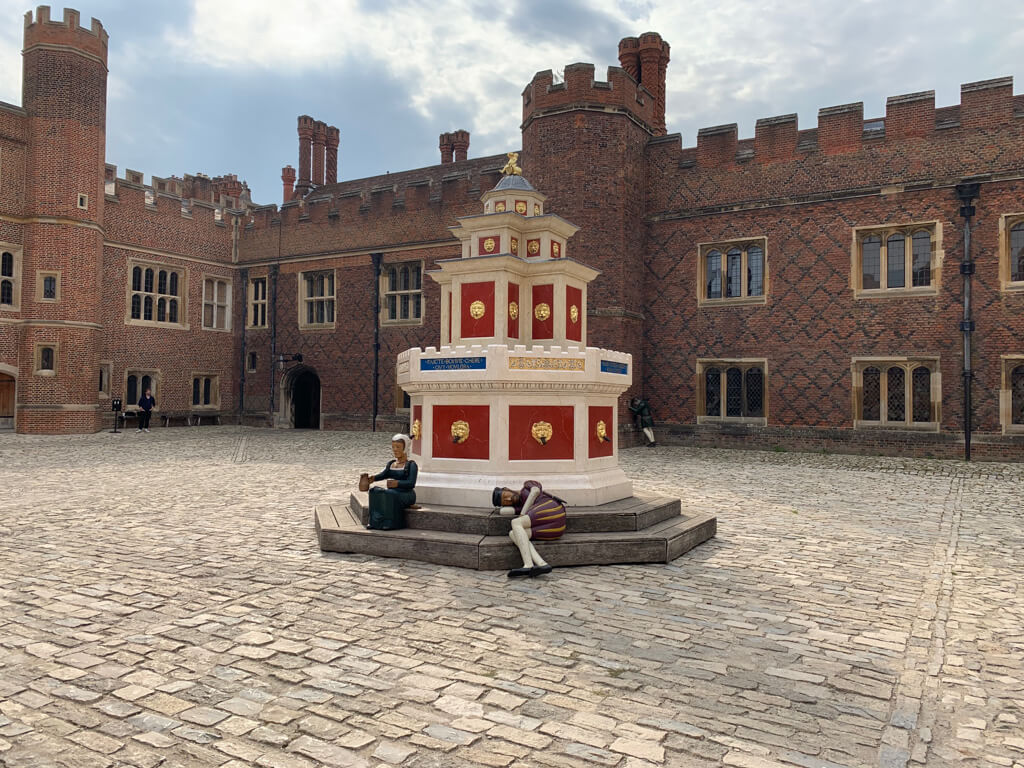 Grand Tudor courtyard with lifelike model figures. Copyright@2023mapandfamily.com 