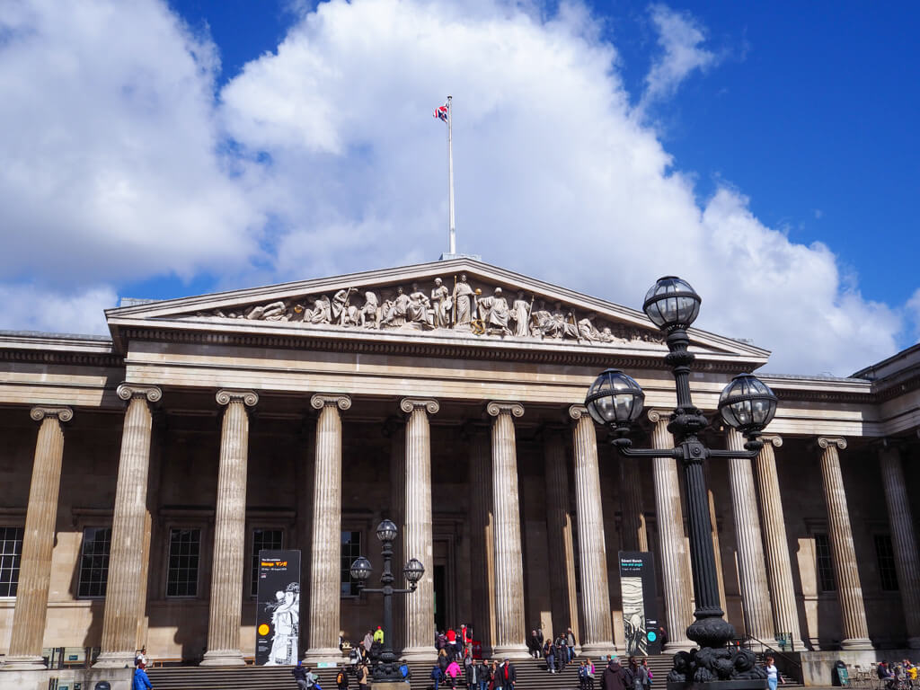 Grand portico of British museum with columns and carved pediment. Copyright@2023 mapandfamily.com