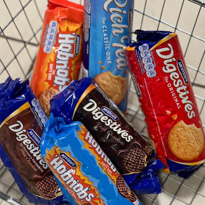 Best British snacks, a selection of biscuit packets in a supermarket basket, Copyright@2023mapandfamily.com