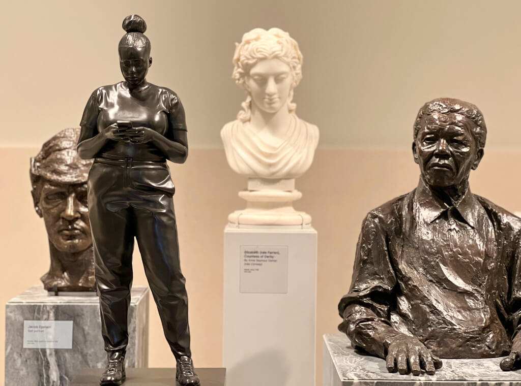 Four very different sculptures of people from classical to modern. Copyright@2023 mapandfamily.com