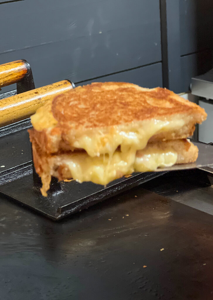 Gooey cheese toasty, cut in half. Copyright@2023 mapandfamily.com