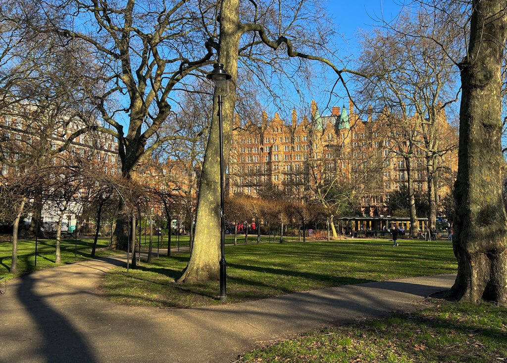 Russell Square London in January showing the garden and cafe with the historic Kimpton Fitzroy hotel in background. Copyright@2024 mapandfamily.com 