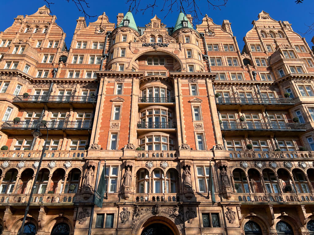 Russell Square hotel exterior showing the terracotta tiling and statues on facade of Kimpton Fitzroy hotel. Copyright@2024 mapandfamily.com 