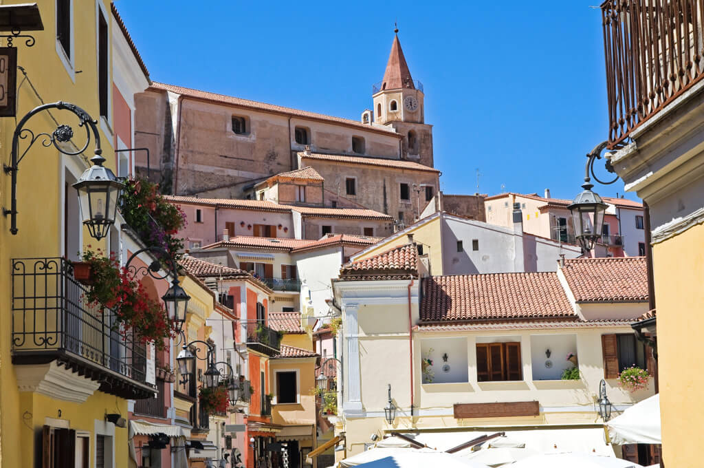Pink and yellow shades and terracotta tiles in the historic centre of Maratea. Copyright/Depositphotos