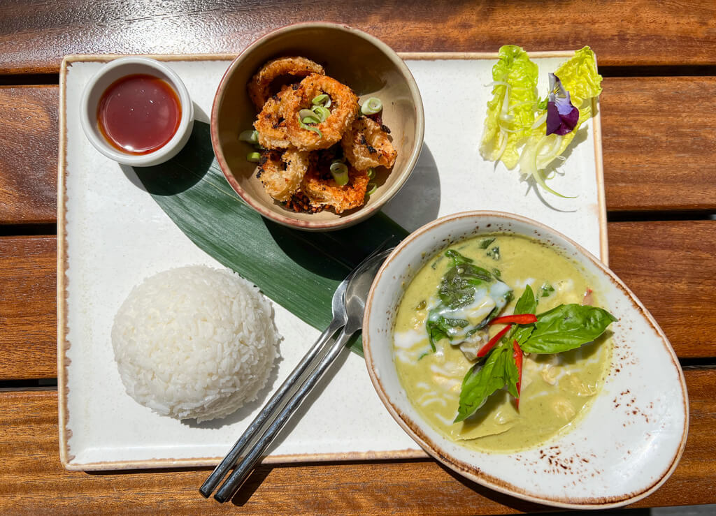 A ceramic tray with dishes that make up a Thai set lunch including curry and calamari at Patara Wimbledon. Copyright@2024 Nancy Roberts