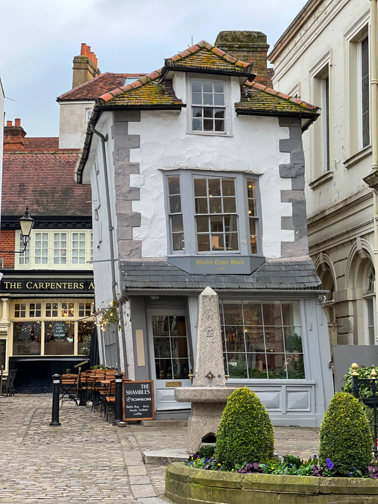 Old and very crooked house leaning into courtyard in Windsor. Copyright@2025 NancyRoberts