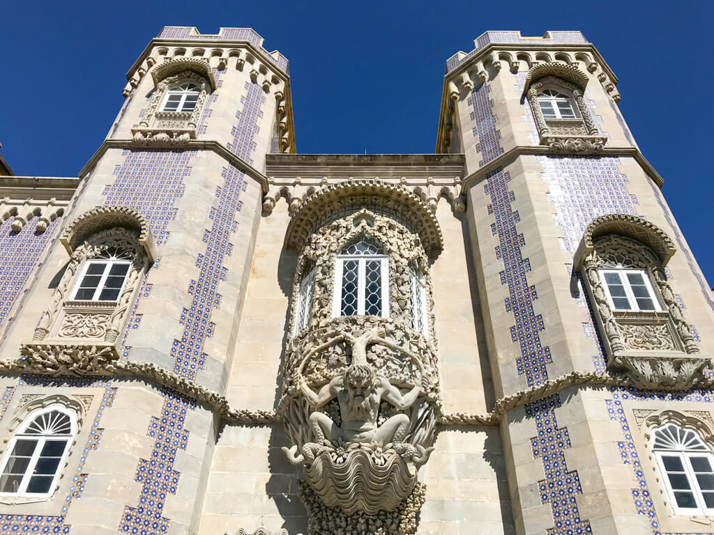 The striking sculpture of a sea god at the entrance to Pena Palace. Copyright@2025 NancyRoberts