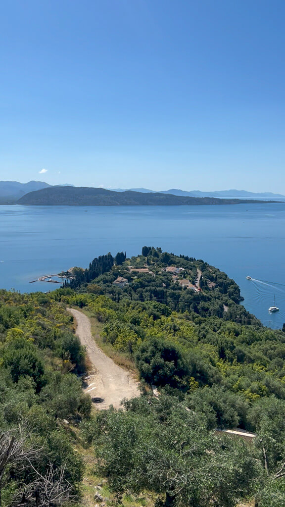 View from luxury Villa Bliss in Corfu showing country lane and headland of Kouloura harbour. Copyright@2025NancyRoberts