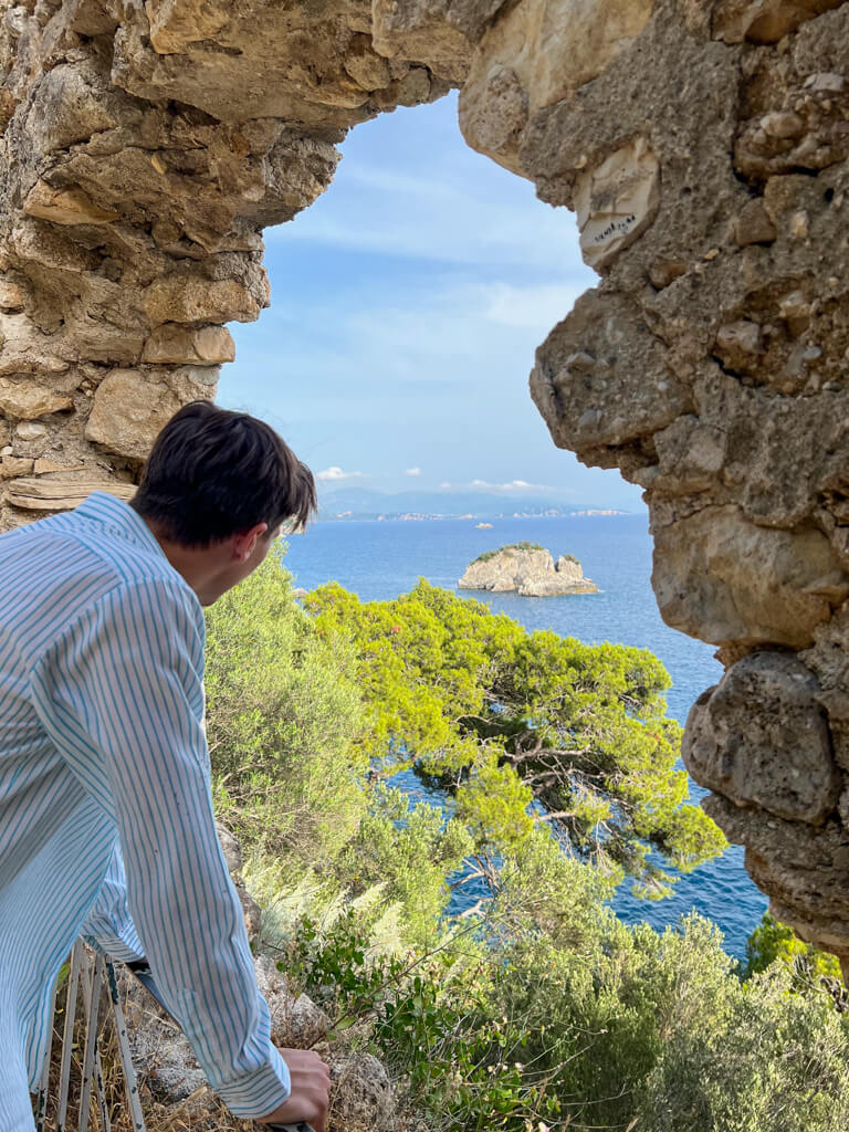 Looking through a ruined archway from Parga castle out to sea. Copyright@2025 NancyRoberts
