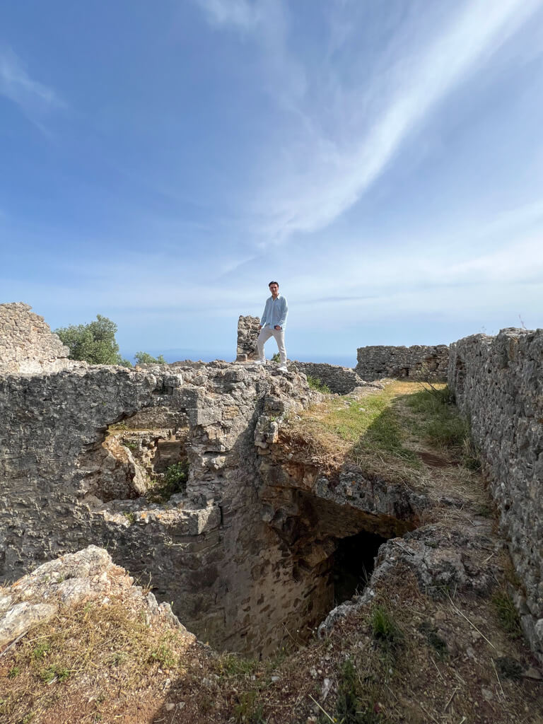 Standing amidst the ruins on the top of a wall at Anthoussa.castle near Parga. Copyright@2025 NancyRoberts