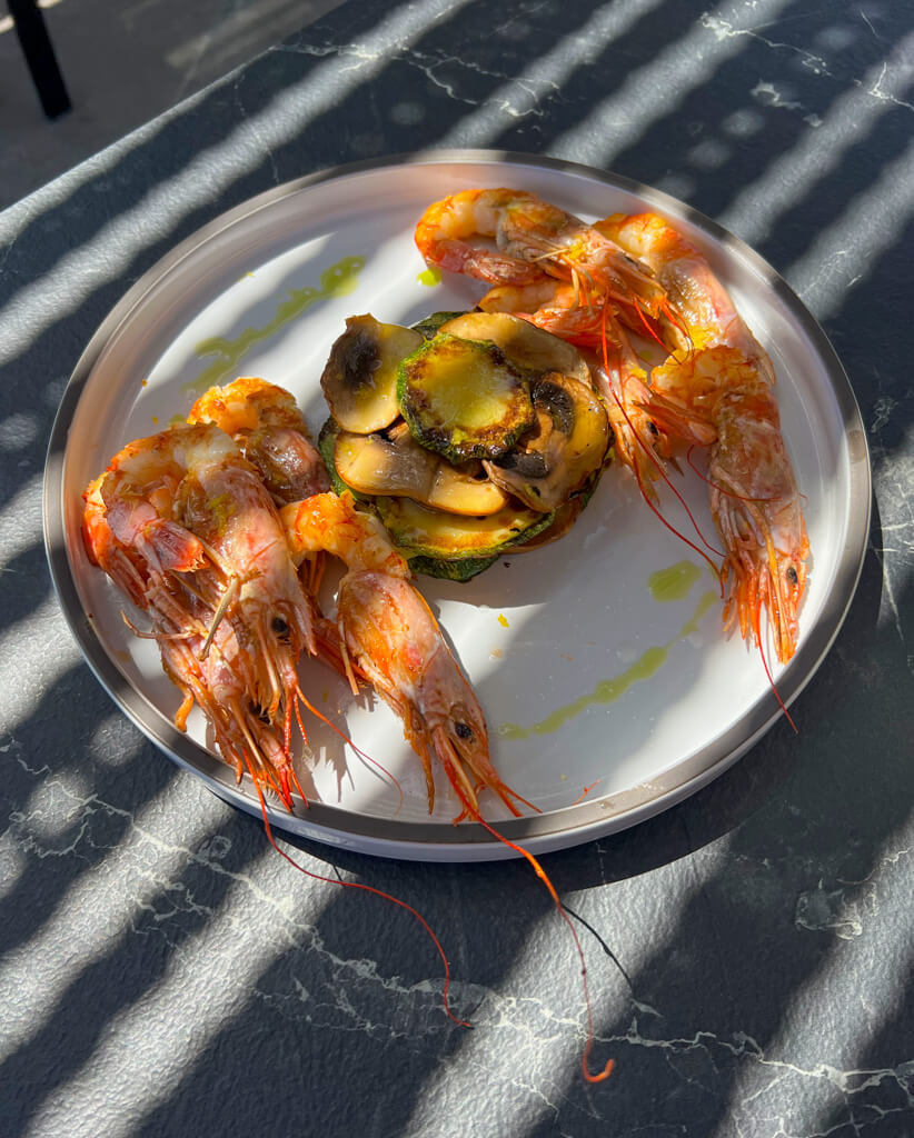 Grilled shrimp and a courgette timbale. Copyright@2025 NancyRoberts