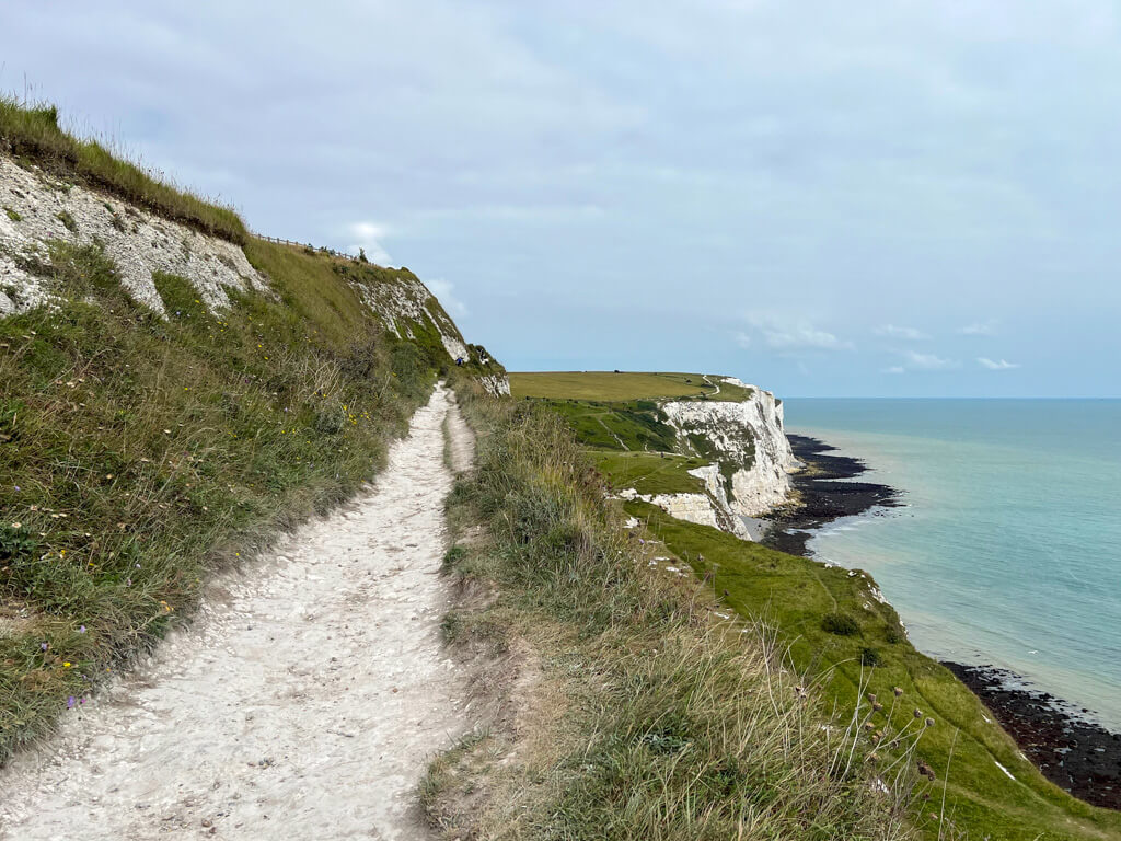 The chalky cliff face and coast paths at the White Cliffs, Dover. Copyright@2025 Nancy Roberts